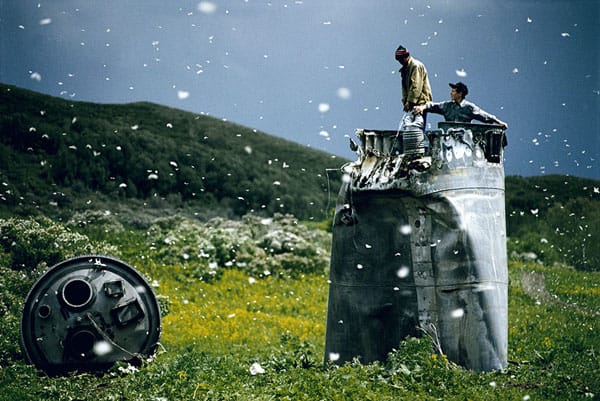 RUSSIA. Altai Territory. 2000. Villagers collecting scrap from a crashed spacecraft, surrounded by thousands of white butterflies. Environmentalists fear for the region's future due to the toxic rocket fuel.
